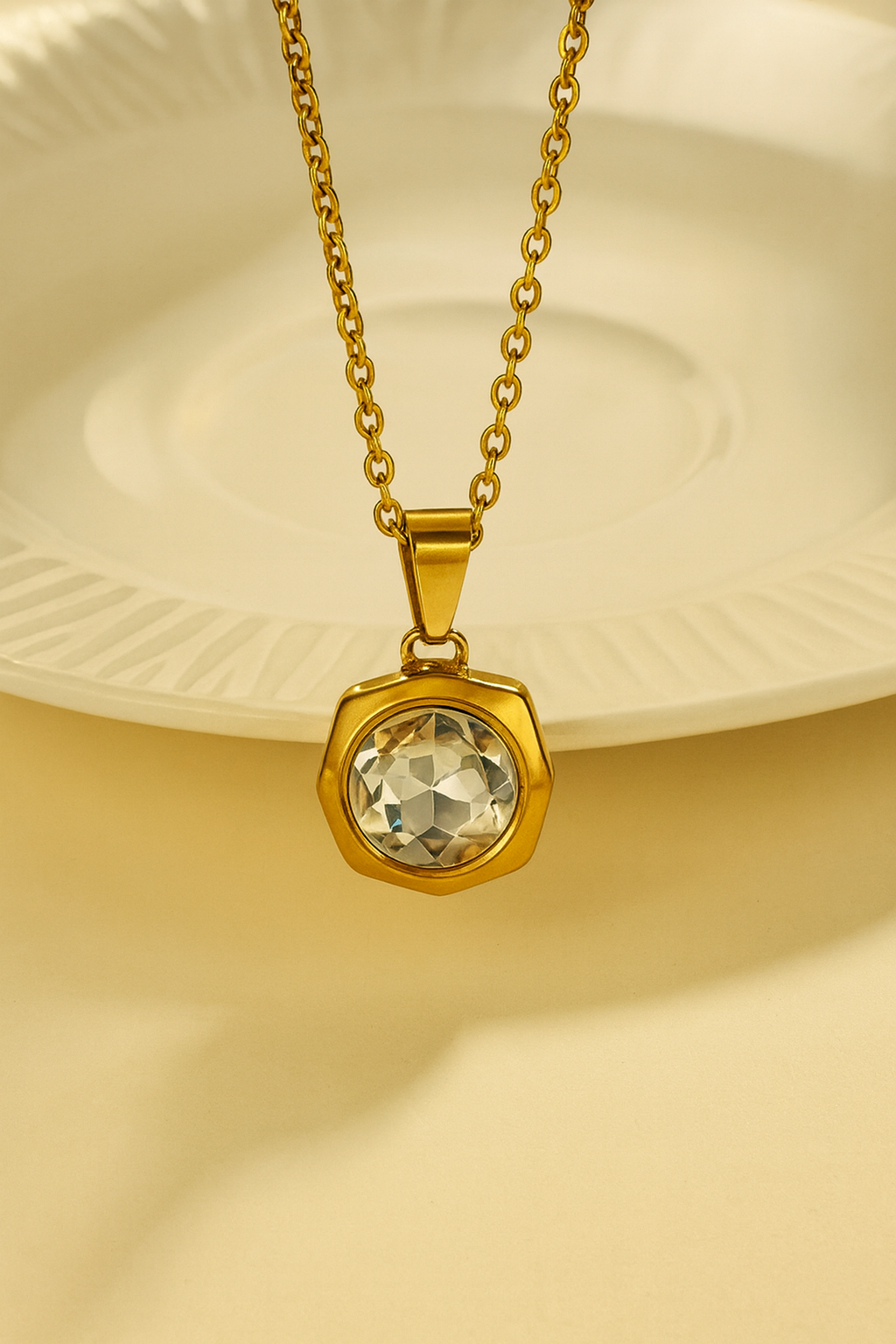 Geometric pendant necklace adorned with a white zircon